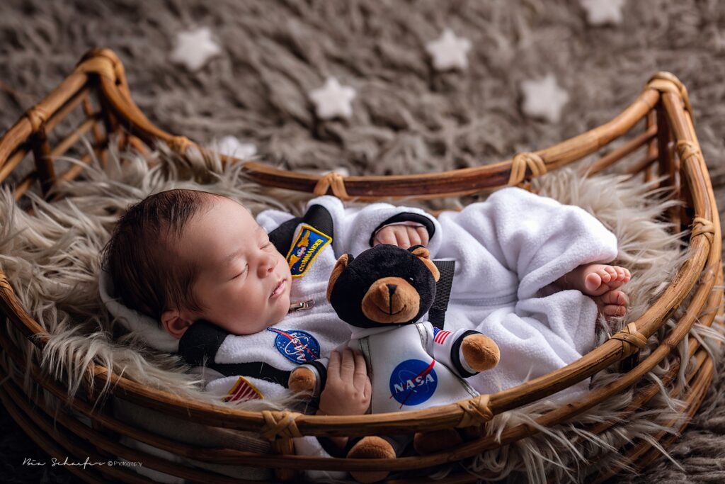 baby with astronaut suit, nasa newborn photography