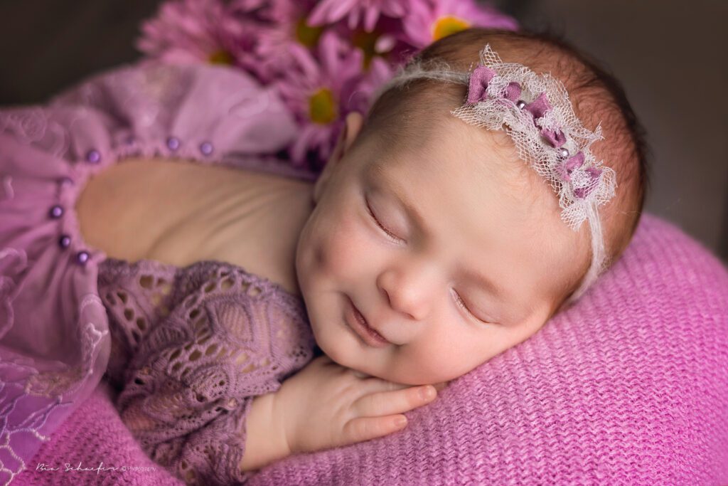 Purple flowers newborn session in Orlando, Florida.  