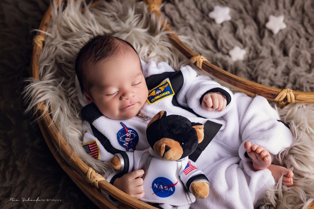 baby with astronaut suit, nasa newborn photography